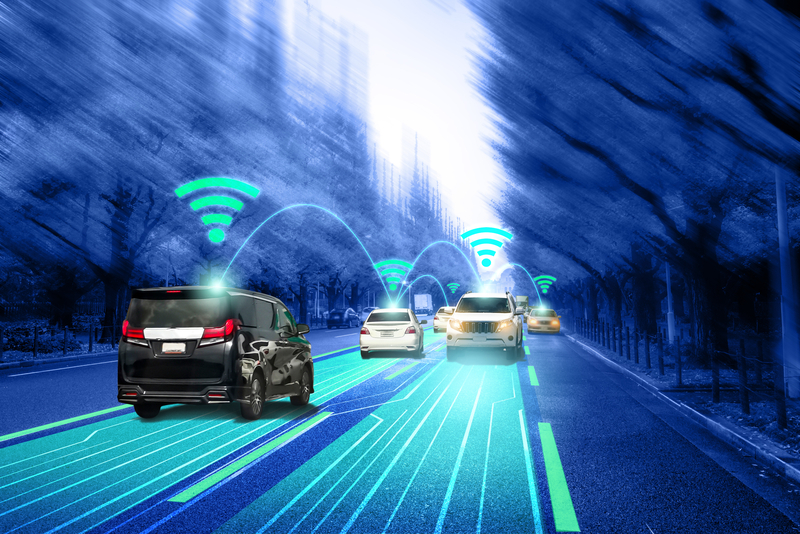 Highway with cars showing glowing ADAS radar and connectivity systems visualization